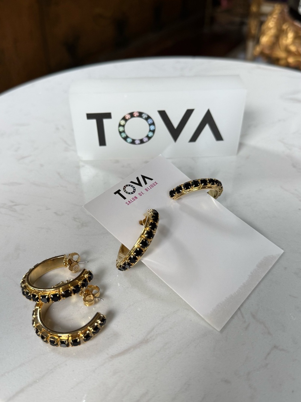 TOVA chunky hoops with black crystals.
